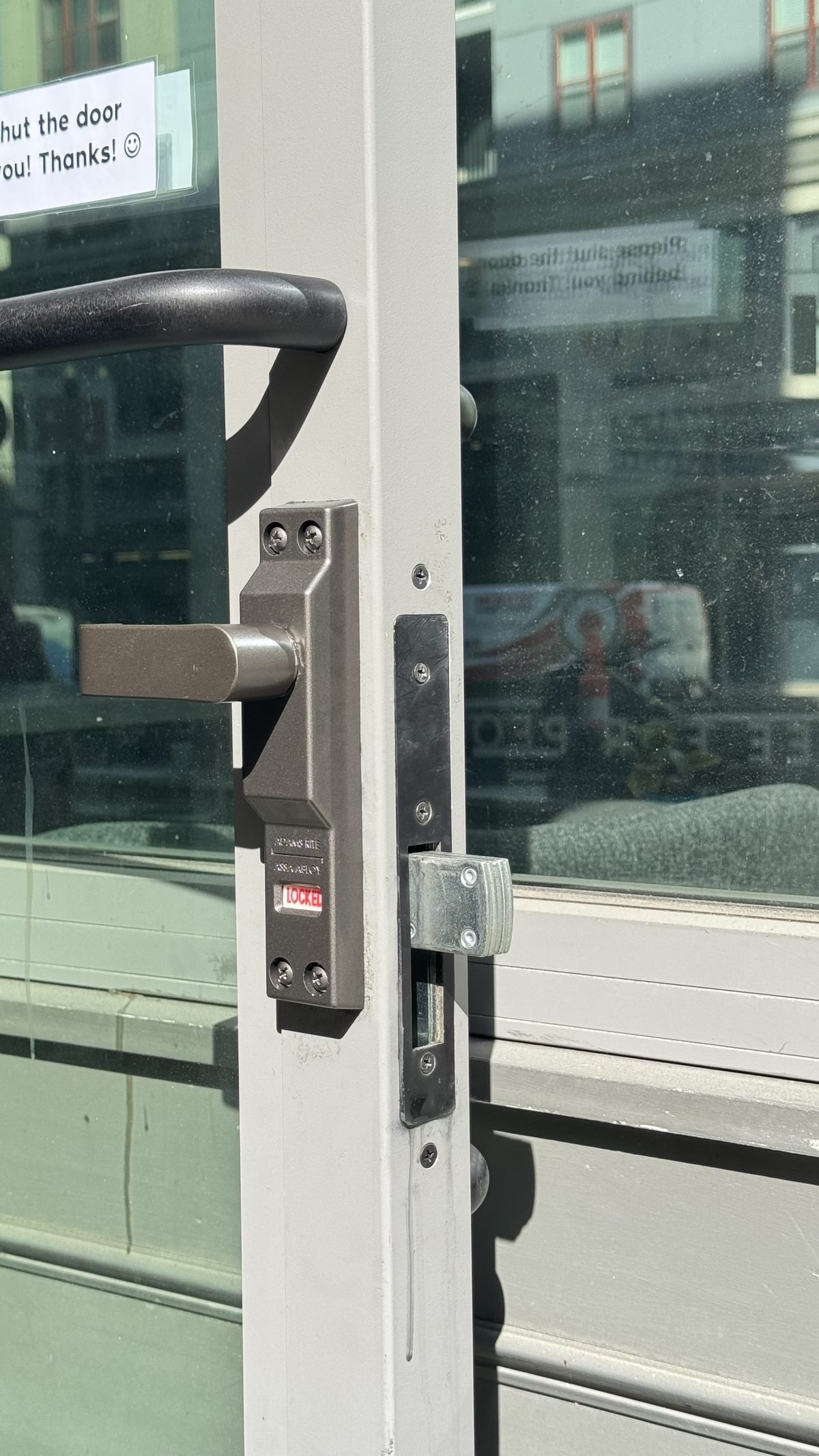 Commercial glass door deadbolt and latch hardware serviced by Locksmith Powell Ohio — storefront door lock repair in Delaware County Ohio